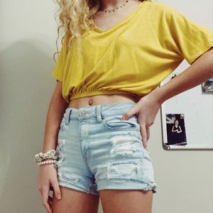 Mustard colored cropped blouse.